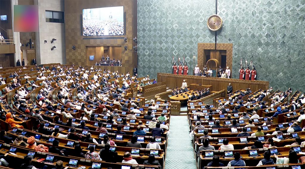 December 2024 winter session in the new Indian Parliament with legislators in discussion. Image source: DD News, Prasar Bharati, India's Public news channel.